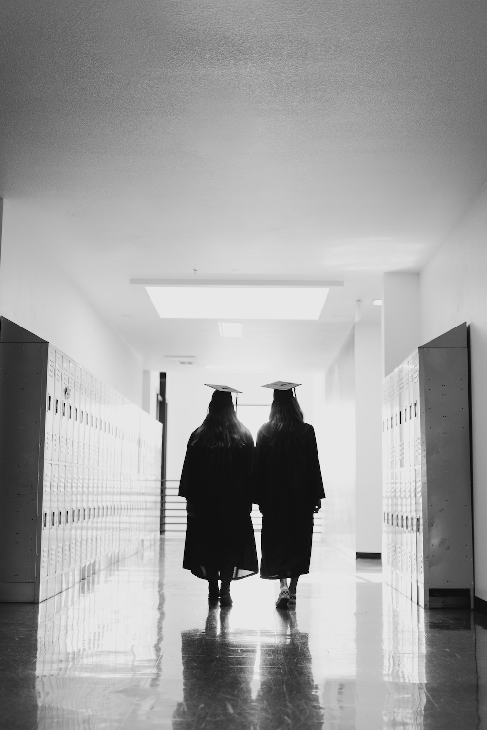 Graduates walking in a hallway